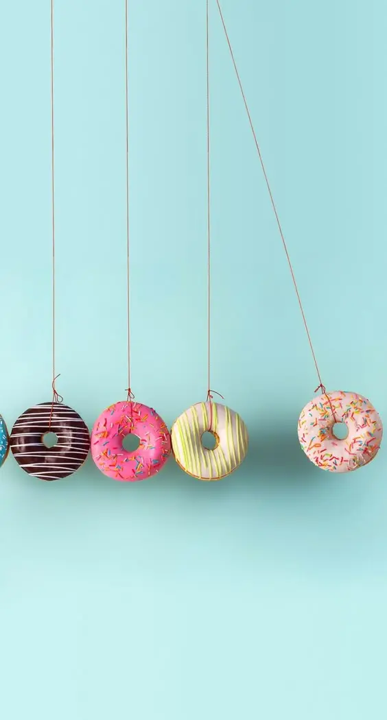 A Newton's cradle of doughnuts